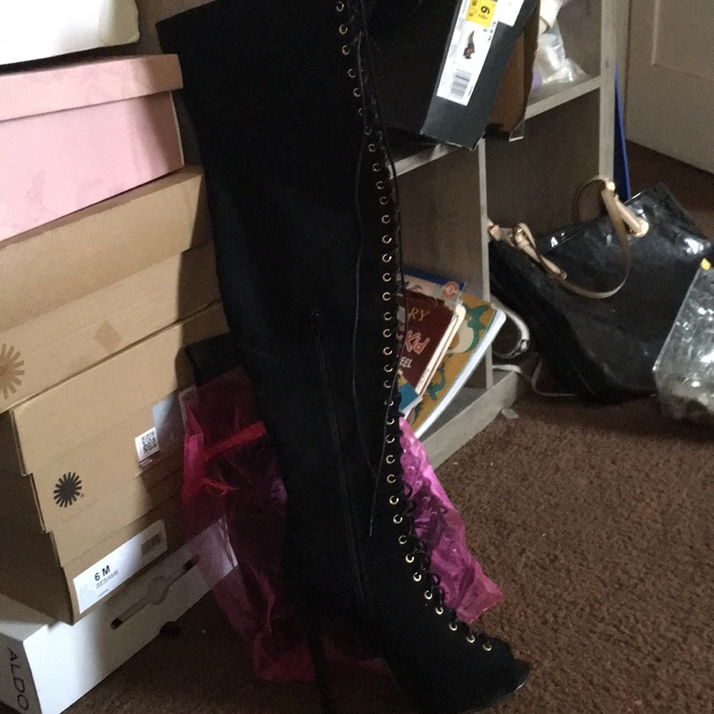 Thigh high lace up heel boots